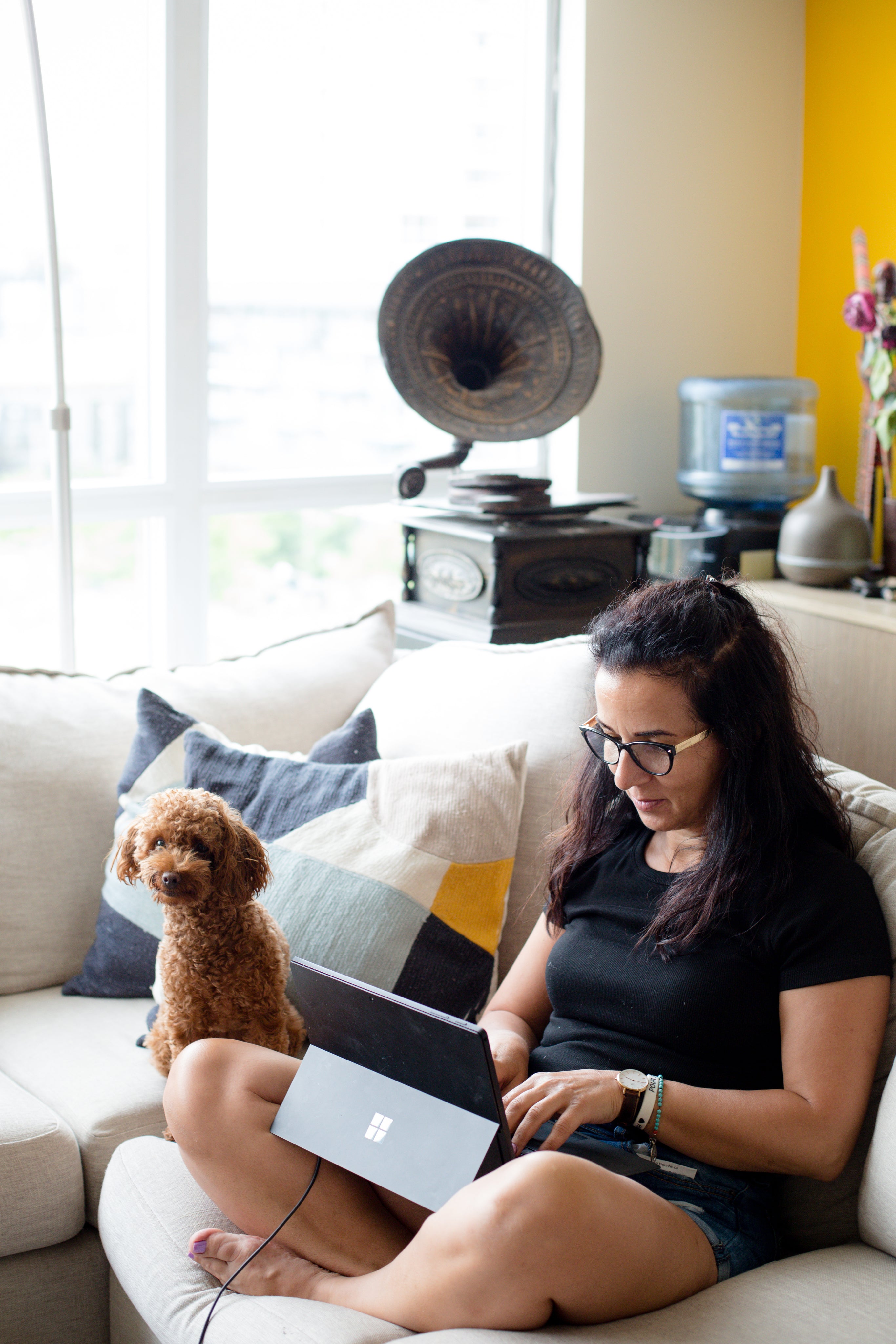 files/person-sits-on-their-couch-next-to-their-dog.jpg